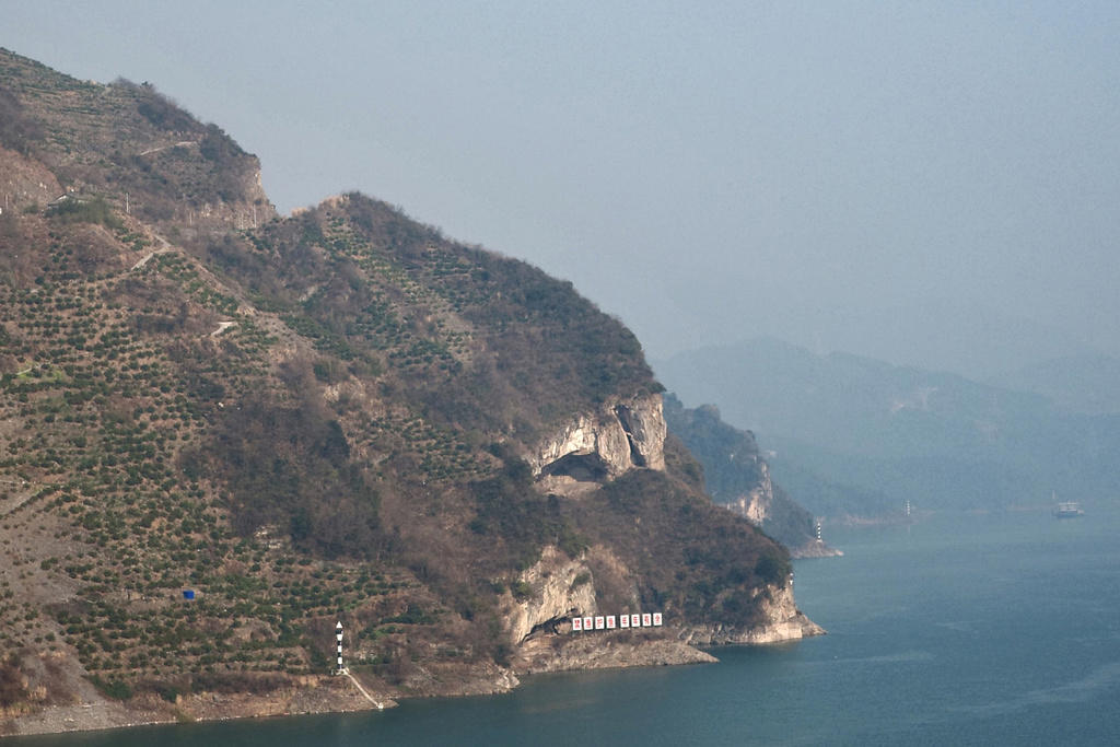 photograph of a seaside mountain in China that looks like the head of a dog in profile